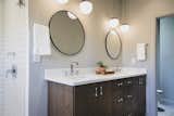 Pendant lighting in bathroom with dual vanity in owner's bath. 