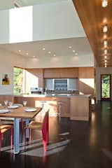 Kitchen, Wood Cabinet, Metal Backsplashe, Cork Floor, Wood Backsplashe, Concrete Counter, Recessed Lighting, Accent Lighting, and Ceiling Lighting  Photo 5 of 23 in Marsh House by McInturff Architects