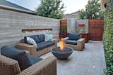 Outdoor, Shrubs, Garden, Back Yard, Gardens, Walkways, Small Pools, Tubs, Shower, Hardscapes, Concrete Pools, Tubs, Shower, Large Patio, Porch, Deck, Stone Patio, Porch, Deck, Metal Patio, Porch, Deck, Horizontal Fences, Wall, Planters Patio, Porch, Deck, Metal Fences, Wall, and Landscape Lighting outdoor living room-evening  Photo 5 of 7 in Mueller 1 by J Sqaure Architecture