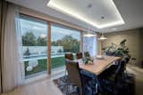 Dining Room, Table, Chair, Ceiling Lighting, and Light Hardwood Floor  Photo 14 of 17 in Next House by Razvan Barsan + Partners