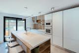 Kitchen, Ceramic Tile Floor, Drop In Sink, and Ceiling Lighting  Photo 9 of 11 in From Sky to Sea by Razvan Barsan + Partners