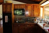 A before pic. Beautiful walnut that was glued to old wood cabinets. What you can't see? Saw dust under all the drawers.