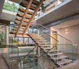 Staircase, Concrete Tread, and Metal Railing  Photo 5 of 12 in The Atrium House by Studio Saxe