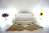 Round white leather bed inside the dome interior master bedroom upstairs loft