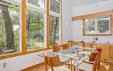 Dining Room, Track Lighting, Cork Floor, and Table Dining Area  Photo 9 of 28 in Classic Mid Century Modern home for sale by John-Michael Young
