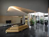 The fully penetrable lobby next to the living space opens various visual dimensions  linking to different areas. In addition, the winding array of columns also lead fluid circulation with repetitive rhythm.