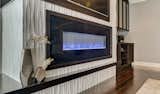 The 3form panel surrounding the ribbon fireplace adds a unique element to the living room.