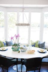 Custom pillows in an iconic Thibaut fabric flank the breakfast nook bench. 