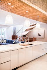 Kitchen, Engineered Quartz Counter, Dishwasher, White Cabinet, Pendant Lighting, Ceramic Tile Floor, and Undermount Sink  Photo 6 of 28 in Bound Together by Big Sky Design