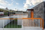 Outdoor, Back Yard, Tile Patio, Porch, Deck, and Metal Fences, Wall  Photos from FF Houses