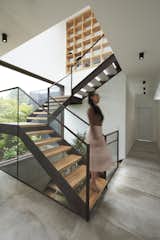 Staircase, Wood Tread, Glass Railing, and Metal Tread  Photo 9 of 15 in INTERLACE HOUSE by TEC Taller EC