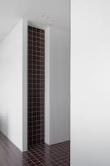 Tiles along the walls - an interesting architectural trick that allows us to get away from the standard skirting board.  Photo 9 of 19 in NB11 APARTMENT by ZROBIM architects