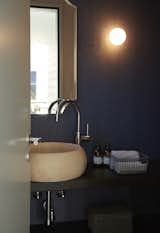 Bath Room, Wood Counter, Terrazzo Floor, Drop In Tub, One Piece Toilet, Vessel Sink, and Wall Lighting Guest toilet  Photo 6 of 6 in The house ISIS by Roomdresser