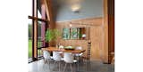 Dining Room, Table, Chair, Wall Lighting, and Concrete Floor  Photos from Passive Home Interiors