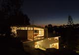 Outdoor, Trees, Back Yard, Rooftop, Side Yard, Garden, Woodland, Slope, and Small Patio, Porch, Deck Master Suite at night  Photo 14 of 21 in Oaks Parkhouse by blue point architecture