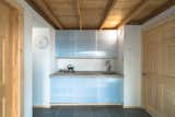 Kitchen, Concrete Counter, Wood Cabinet, Slate Floor, Ceramic Tile Backsplashe, Wall Lighting, Cooktops, and Undermount Sink  Photo 7 of 14 in MARTaK Passive House by Hyperlocal Workshop
