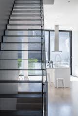 Staircase, Metal Tread, and Metal Railing Main stair made of perforated steel  Photo 6 of 10 in Mohawk House by UrbanLab
