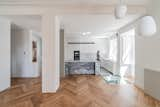 Kitchen, Microwave, Granite Counter, Ceiling Lighting, Wall Oven, Medium Hardwood Floor, Undermount Sink, and White Cabinet  Photo 9 of 34 in VILA FERREIRA by KEMA studio