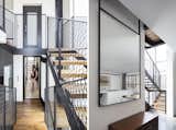 The Charm Townhouse - Airy vertical circulation - hovering stairs surrounded by full height windows and detached walls