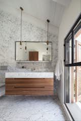 The Charm Townhouse - Master bathroom - cut to size 'Carrara Bianco' tiles intensifying the high ceiling