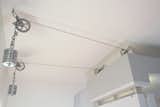 Folding entry wall pulley system