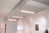 Entry wall connected to soffit over front end of main multi-mode room