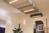 Soffit over rear end of main multi-mode room with kitchen beyond
