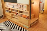 Kids, Bedroom, Playroom, Storage, Shelves, Bookcase, Medium Hardwood, Pre-Teen, Boy, and Neutral Close-up stair to sleeping loft with storage compartments, including back-lit acrylic display box  Kids Playroom Boy Medium Hardwood Photos from LO Residence Playroom/Bedroom