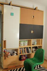 Closeup moving storage unit with work table (up) and usable surfaces on doors: dry erase, cork, and chalkboards