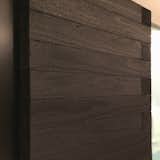 Close-up of Shou Sugi Ban charred wood cladding on walk-in closet in master bedroom