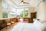 Bedroom, Bed, Medium Hardwood Floor, Ceiling Lighting, and Bench  Photo 5 of 8 in The Hillside Second Story by SATO Architects