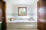 Bath Room, Engineered Quartz Counter, Undermount Tub, Soaking Tub, Porcelain Tile Floor, Ceiling Lighting, Mosaic Tile Wall, and Porcelain Tile Wall  Photo 7 of 8 in The Hillside Second Story by SATO Architects