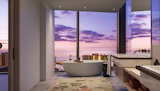 The Residences at Mandarin Oriental, Honolulu, Hawaii

Designed by Dianna Wong, this sleek bathroom will have you wanting to slip into the tub and watch the sunset on an iconic skyline. Lying within The Residences at Mandarin Oriental, Honolulu, this bathroom’s future residents will have the privilege of living on the most iconic street corners in the state of Hawaii adjacent to the Hawaii Convention Center. Mandarin Oriental Hotel and Residences, Honolulu will serve as a new gateway to Waikiki and Ala Moana, bringing one of the world’s most renowned hotel brands back to the city. The 37-story mixed-use project is being conceived by a roster of international designers – including Meyer Davis, Dianna Wong and Hart Howerton – that is unprecedented for Hawaii. Rising 418 feet above Honolulu, the iconic 743,000-square-foot tower will house 125 chic and contemporary guestrooms and suites, designed to reflect the local culture while paying homage to Mandarin Oriental Hotel Group’s heritage. Located on the tower’s upper floors starting at level 19, a collection of 99 exclusive residences will represent the most distinguished residential offering available in the world. Amenities will include a speakeasy-inspired hidden dining space, a Peloton room, karaoke room, the largest spa in Oahu, a rooftop lounge with cabanas and fire pits, and more. Prices for select residences begin around $2 million and range up to $35 million, the latter representing the most expensive penthouse currently on the market in Honolulu.