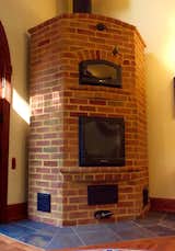 If you've never heard of a masonry heater fireplace, do yourself a big favor and investigate its extreme home-warming capabilities.  One 2.5 hour fire warms this home for 20+ hours.