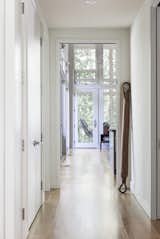 Hallway and Light Hardwood Floor  Photo 7 of 11 in The Hammock House by Altura Architects