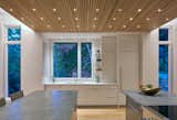 Kitchen, Dishwasher, Ceiling Lighting, Undermount Sink, Recessed Lighting, White Cabinet, and Medium Hardwood Floor  Photo 14 of 15 in The Lookout by Altura Architects