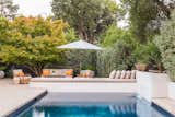 Backyard pool with 18-foot tile bench with custom upholstery