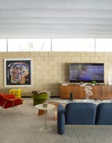 A big screen television is the only piece of 21st century furniture found in the homage to midcentury that Florentino has assembled in his home.