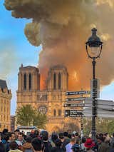 Crowds gathered as flames consumed one of Paris' most historic landmarks.