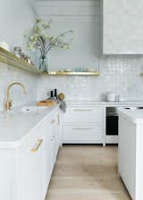Keren Richter selected an unlacquered brass faucet by Studio Ore to sit above a White Arrow custom-designed integrated marble sink in this pre-war Berlin renovation.  Photo 6 of 11 in How Much Should You Spend on a Kitchen Faucet?