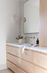 Wall sconces work well in bathrooms, as the light is closer to your face. "Overhead lighting can create shadows and uneven illumination, whereas wall sconces can project light outward instead of downward, and close to eye level," says Lauren Nelson, who designed this Los Gatos master bathroom.&nbsp;&nbsp;