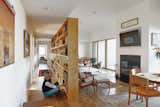 The bookcase that separates the communal living space from the bedrooms is made of 12" x 10" x 30" and 60” plywood boxes.