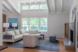Living Room, Sofa, Medium Hardwood Floor, End Tables, Recessed Lighting, Chair, Wood Burning Fireplace, and Lamps Added Living Rm dormer and exposed rafters  Photo 3 of 15 in Conservative Contemporary by VAKOTA  architecture