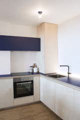 The kitchen with multiplex boards and blue formica