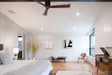 The upper level is reserved for the private bedrooms and a more intimate family room. Hardwood floors flow throughout while large-scale windows seek to capture the unique views offered from each room.