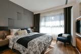 The older couple's bedroom contains large amounts of storage space, which is in accord with their living habits.