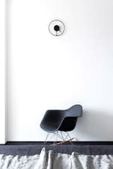 With an ambiguous sense of digital time in living room, the master bedroom features analog minimalism with the Stelton Time wall clock designed by the German design duo Jehs+Laub. The clock’s minute arm is linked with and forms the clock’s face, casting a brilliant shadow behind. The absence of a traditional clock casing creates an illusion of it floating on the wall.
