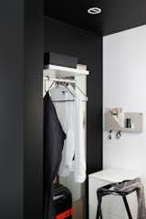The triangle clothes hanger from RoomSafari reminds a musical instrument because of its triangular form and the missing hook, becoming as integral an element as the closet space. The small folded shelves by Muuto play a supporting cast, neatly tucking away a few everyday use stuff in the closet.