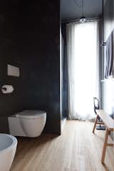 Bath Room, Medium Hardwood Floor, Pendant Lighting, Enclosed Shower, Concrete Wall, and One Piece Toilet  Photo 13 of 19 in Interior LP by Didonè Comacchio