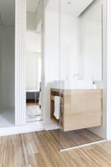 Bath Room, Medium Hardwood Floor, Wood Counter, Vessel Sink, Full Shower, Ceiling Lighting, Concrete Wall, Wall Lighting, and One Piece Toilet  Photo 17 of 19 in Interior LP by Didonè Comacchio
